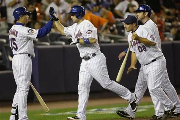 David Wright hits a home run during the second game of a double-header against the Braves.